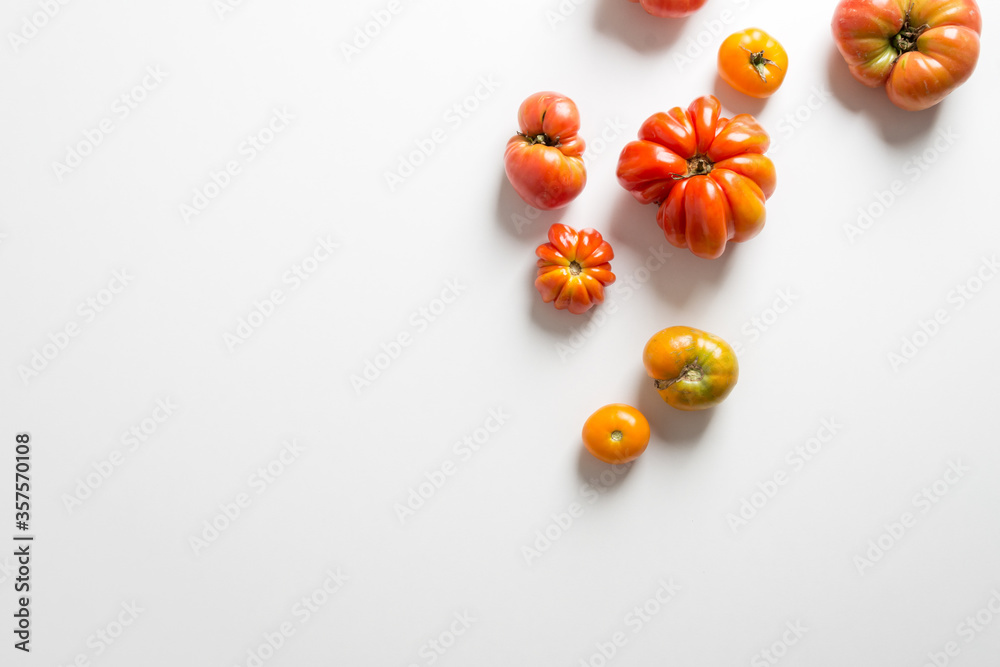 organic red tomatoes on white background organic red tomatoes on white background