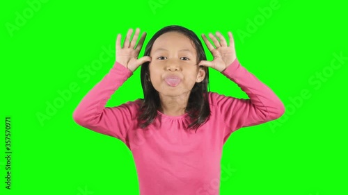 Little girl mocking somebody in the studio