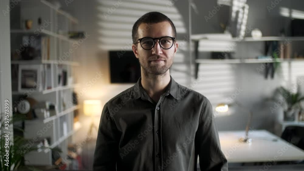 Close Up Portrait Of Young Attractive Happy Handsome Businessman In Glassess Looking At Camera Smiling Confident In Office Workspace Background Real People Series Close Up Portrait Of Young Attractive Happy Handsome Businessman In Glassess Looking At Camera Smiling Confident In Office Workspace Background Real People Series