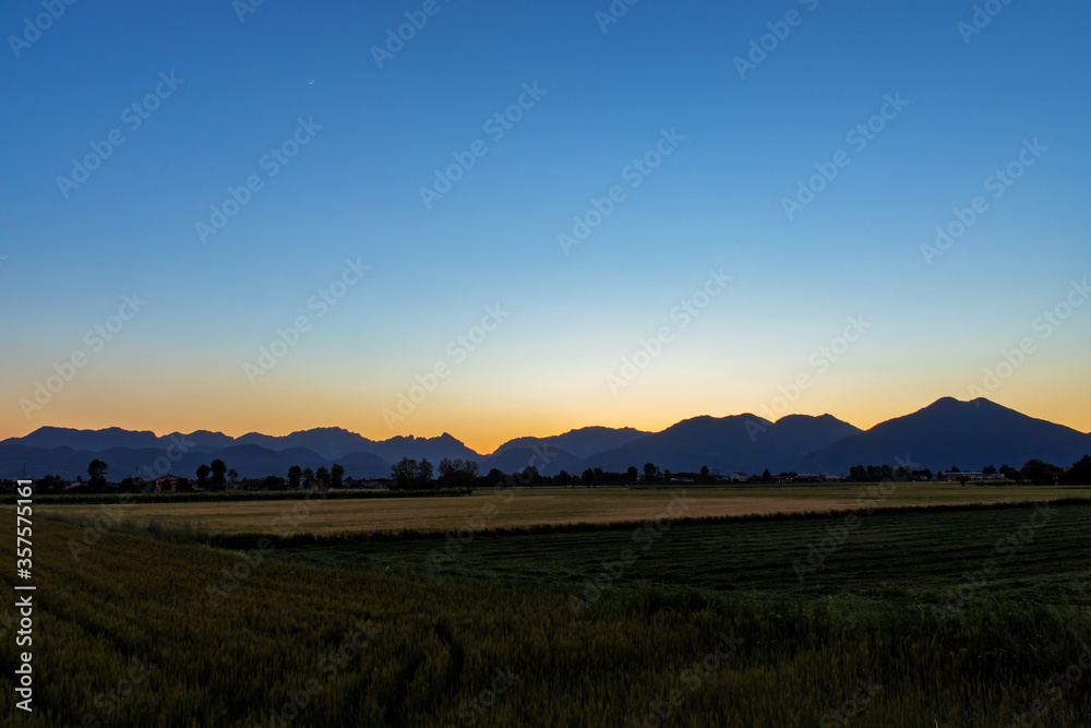 Scenic View Of Field Against Clear Sky, In Alps.