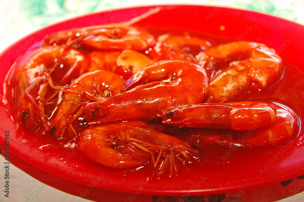 Shrimps with sauce on plate serve in the eatery in Philippines Shrimps with sauce on plate serve in the eatery in Philippines