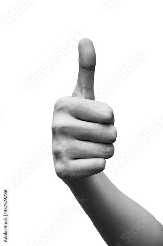 Woman's hand showing thumbs up gesture. Black and white tone. isolated on white background. Hand sign concept.