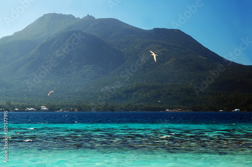 Mount Hibok Hibok with sea beach and sands at white island photo