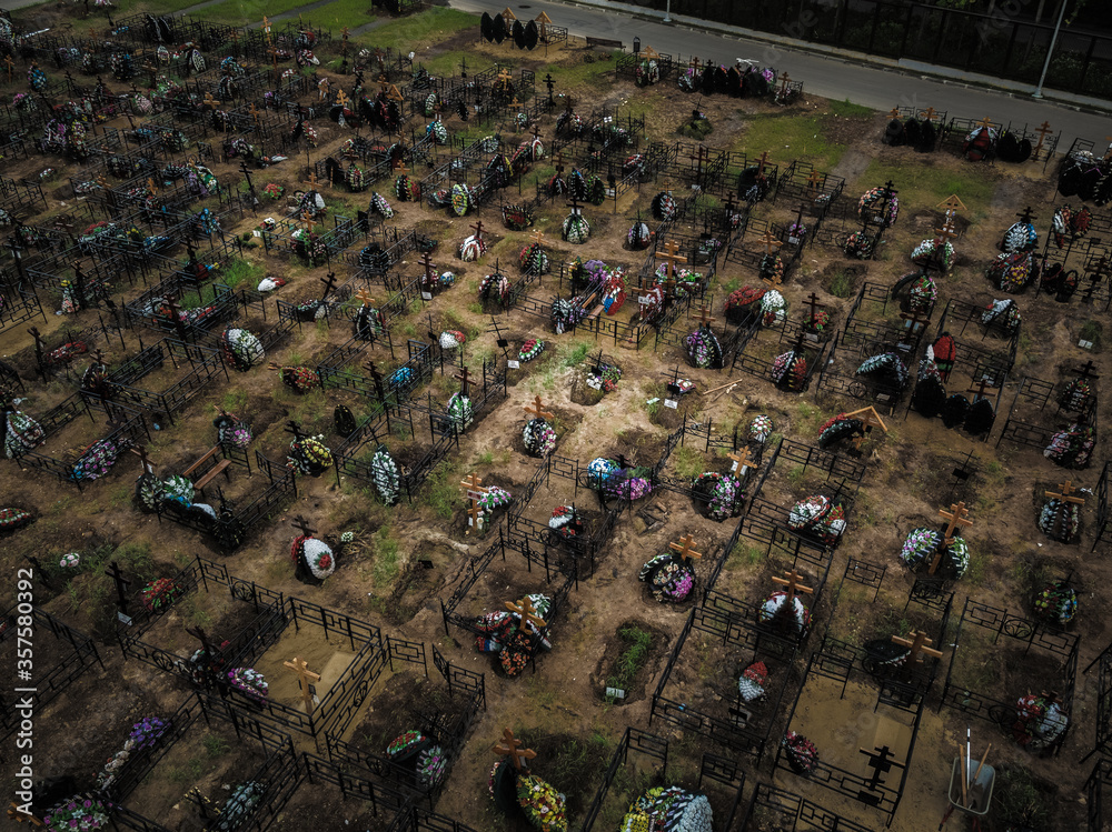 Aerial view of fresh graves in the Butovo cemetery on the outskirts of Moscow on June 11, 2020.