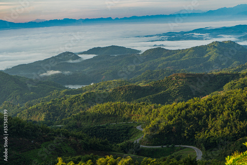 Beautiful Landscape of mountain layer in morning sun ray and winter fog at  Chiangmai, Thailand 