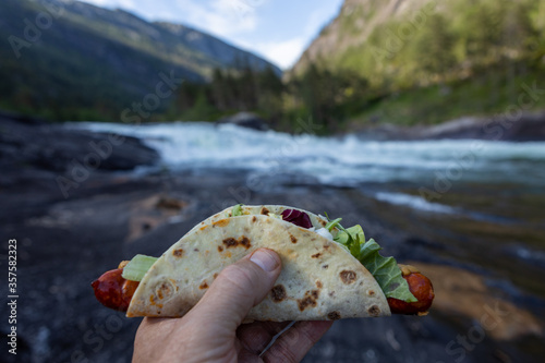 Wrapped sausage with sald in Norweegian nature