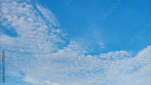 Timelapse of Clouds and Blue Sky. Puffy fluffy white clouds. Cumulus cloud scape timelapse. Summer blue sky time lapse
