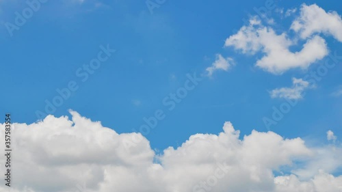 Timelapse of Clouds and Blue Sky. Puffy fluffy white clouds. Cumulus cloud scape timelapse. Summer blue sky time lapse