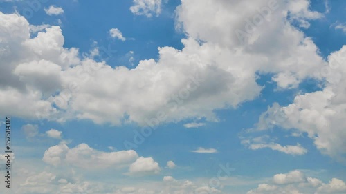 Timelapse of Clouds and Blue Sky. Puffy fluffy white clouds. Cumulus cloud scape timelapse. Summer blue sky time lapse