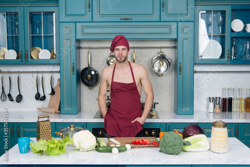 Easy recipes. Vegetarian taste better. Cooking flavors of nature. Bearded man enjoy cooking natural food. Sexy attractive naked chef cook prepare veggies for cooking. Cooking healthy and tasty food photo