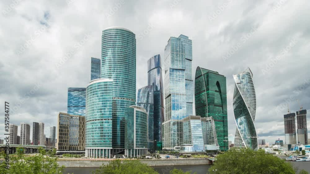 Modern skyscrapers city tower business complex and sun glass reflections 4K 30 fps Modern skyscrapers city tower business complex and sun glass reflections 4K 30 fps