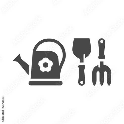 Gardening tools simple black vector icon set. Trowel or shovel with pitchfork and watering can garden icons