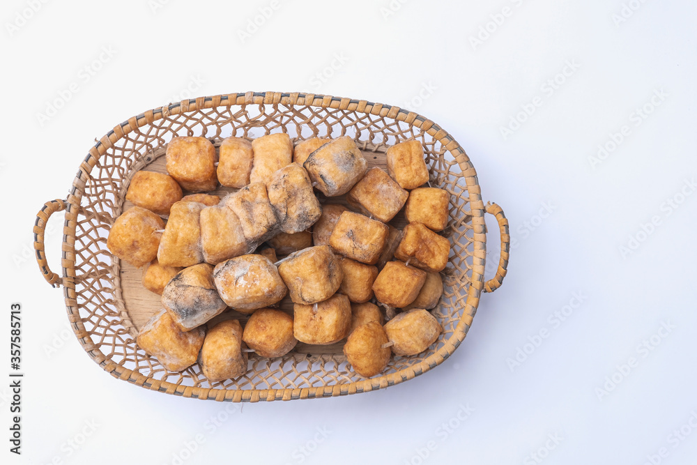Fungi in soybean tofu food in a basket on a white background Fungi in soybean tofu food in a basket on a white background