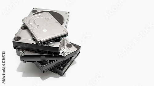 Pile of Hard disk drive HDD isolated on white background. Computer hardware data storage. Copy space