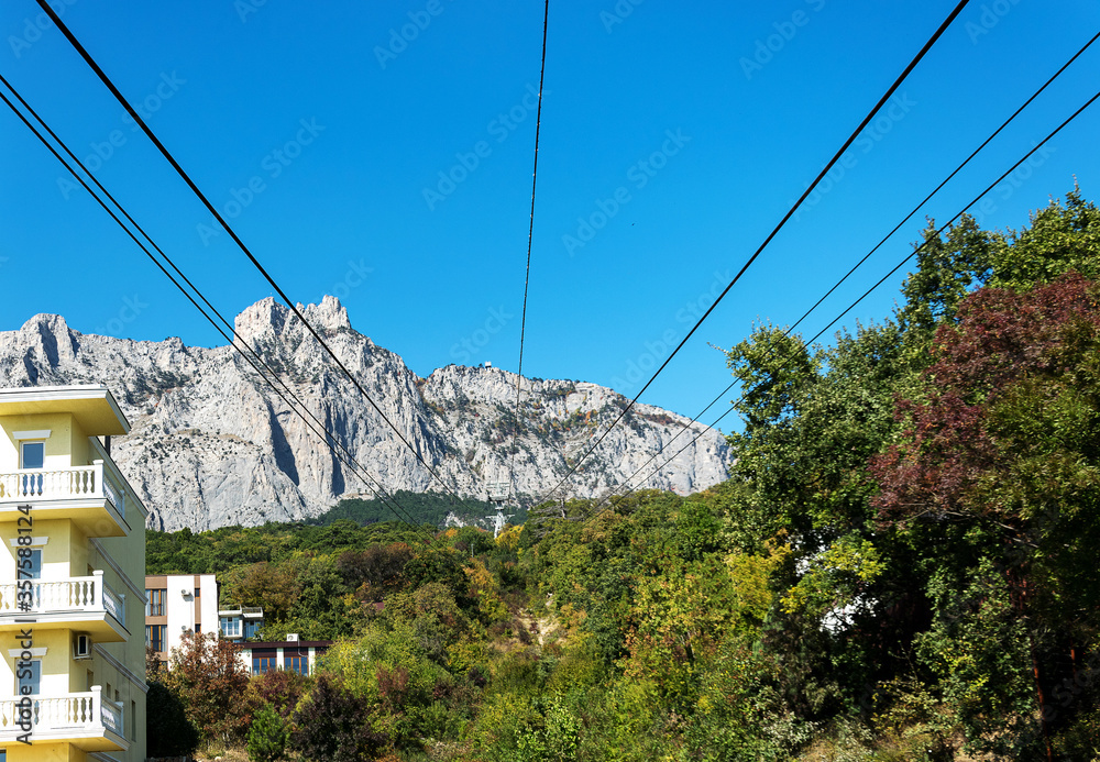 Magnificent views of the highest mountain in the Crimea AI-Petri with a suspended cable bridge. The best walking route for active tourist recreation and tourism. An excellent overview from the height 