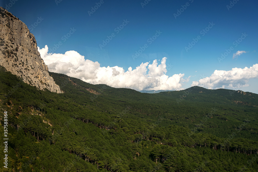 Obraz premium Magnificent views of the highest mountain in the Crimea AI-Petri with a suspended cable bridge. The best walking route for active tourist recreation and tourism. An excellent overview from the height 