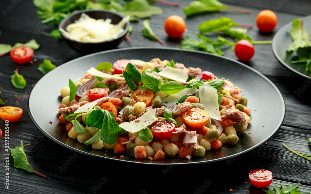 Mini potato gnocchi tricolour with tomato, spinach, Seasonal salad leaves and parmesan cheese Mini potato gnocchi tricolour with tomato, spinach, Seasonal salad leaves and parmesan cheese
