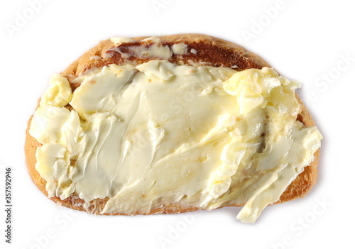 Yellow butter on toast slice, isolated on white background, top view