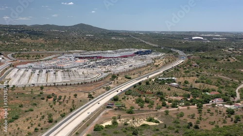 Loulé, Algarve - Portugal: June, 2020 - Aerial Drone View of Ikea, Design Outlet and Mar Shopping Center in Faro, Portugal. Highway with low traffic due to Covid-19