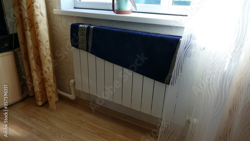Laundry is being dried on the radiator