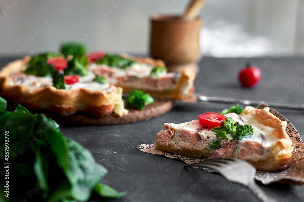 French traditional quiche Lorraine pie with broccoli and salmon