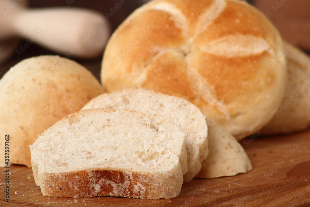 Sliced whole wheat and kaiser bread roll
