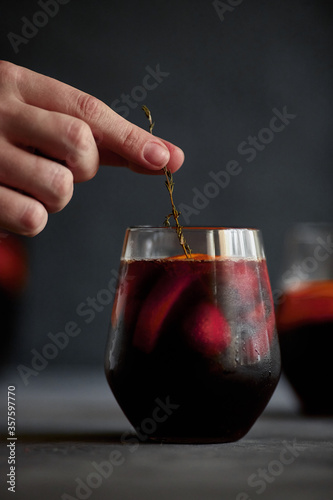 Delicious refreshing sangria. Spanish national drink with oranges, strawberries and ice. Home made production..