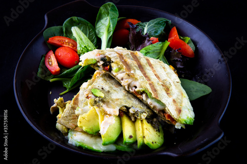 Chicken Quesadilla with avocado, dried tomatoes and jalapeno photo