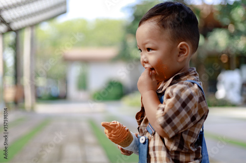 Asia toddler boy kid playing outdoor