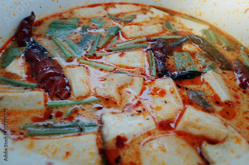 Thai famous food, Close up Tom yum seafood in white bowl