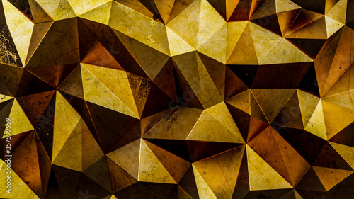 3D rendering of golden color triangle polygonal