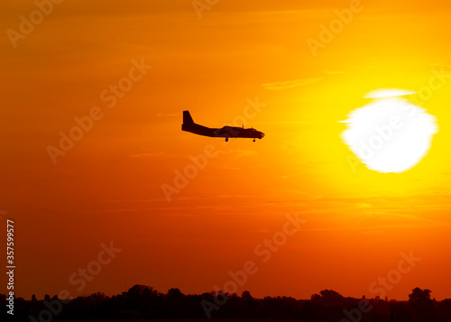 Airplane silhouette during sunset