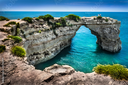 Arch shaped rocks on beach of albandeira in Lagoa, Albufeira, Portimão - Algarve photo