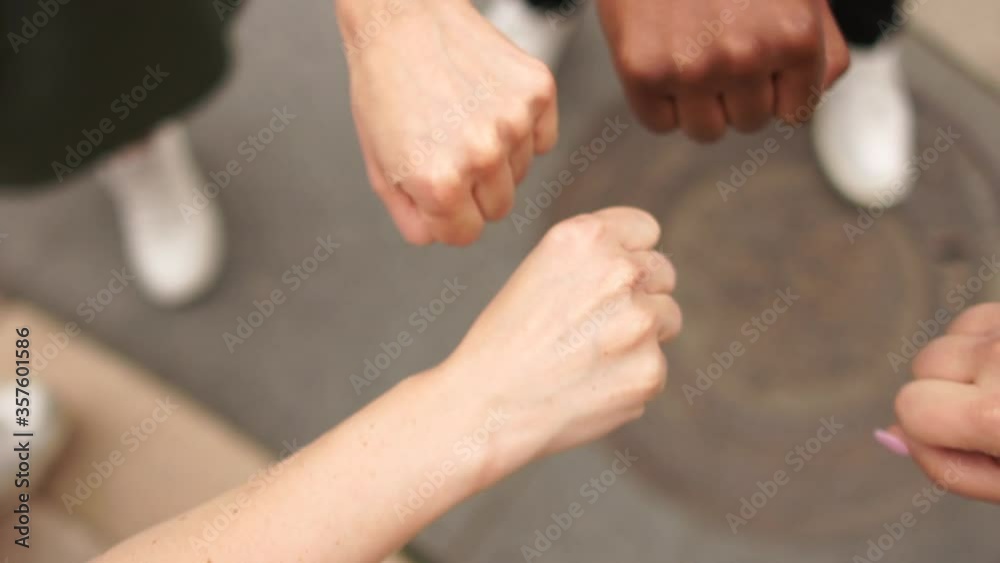 Interracial closed fists, a symbol of unity and solidarity. To support mass protests against racism and violence