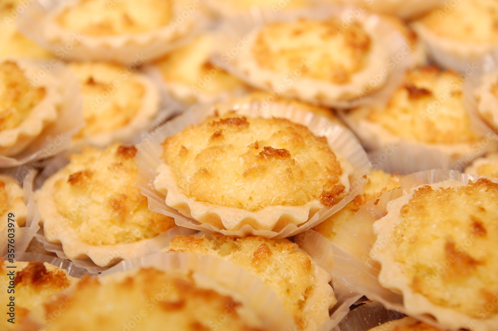 Yellow macaroon pies served in platter