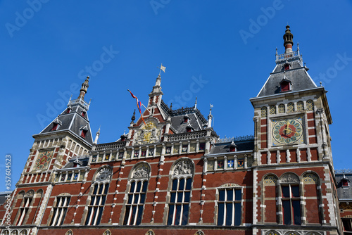 Amsterdam, the Netherlands - April 2020. Historic facade of Amsterdam Central Station © Bert