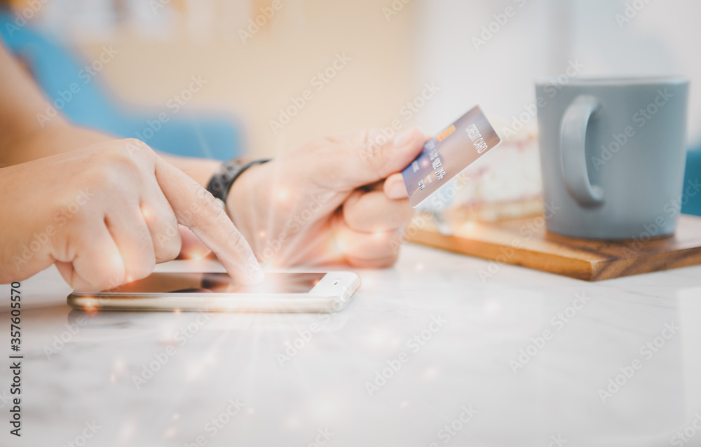 Finger woman touch on screen mobile phone and holding credit card Finger woman touch on screen mobile phone and holding credit card