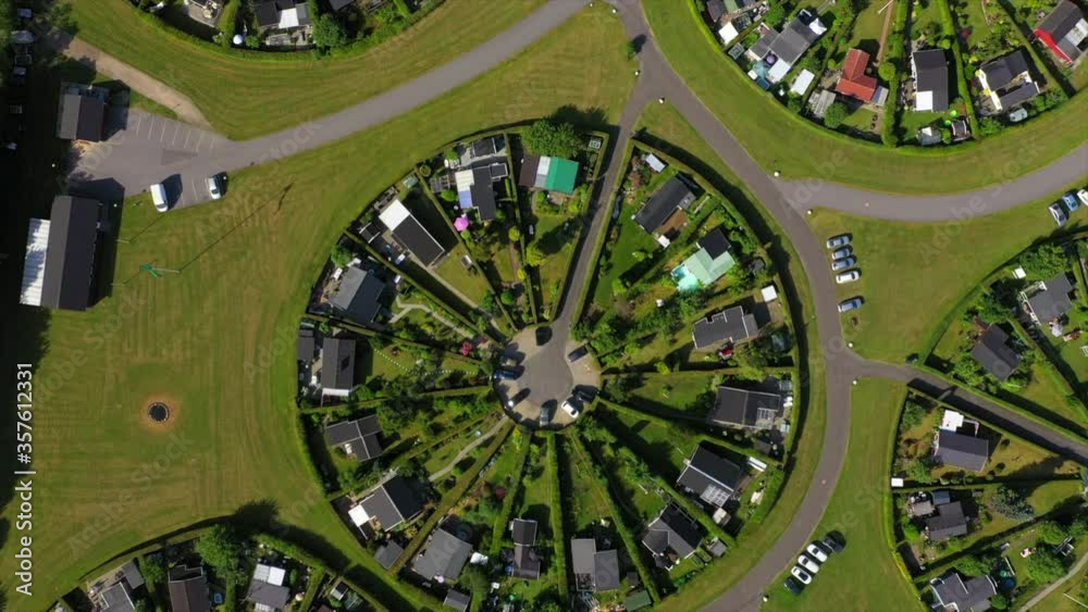 Aerial top view of houses in circular town on sunny day, drone ascending over suburb - Copenhagen, Denmark Aerial top view of houses in circular town on sunny day, drone ascending over suburb - Copenhagen, Denmark