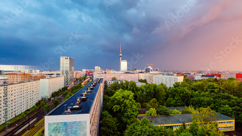 Berlin sunset cityscape aerial view with tv tower in heavy storm conditions