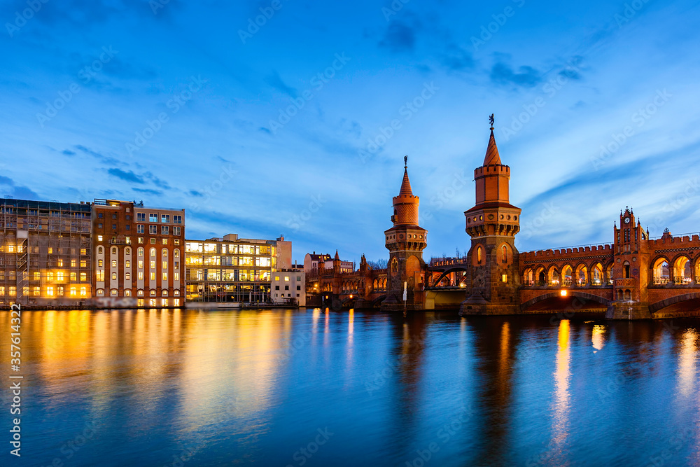 Berlin night cityscape view with oberbaumbridge and spree river