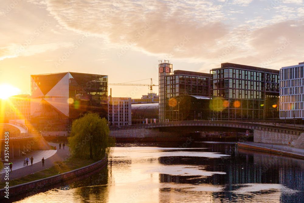 Berlin sunset cityscape view with spree river and office buildings