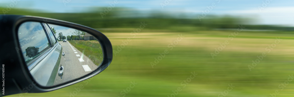 Car driving on the road with motion blur background