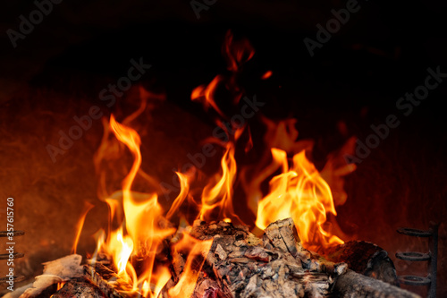 Wood burning in empty barbecue grill, outdoor fireplace grill