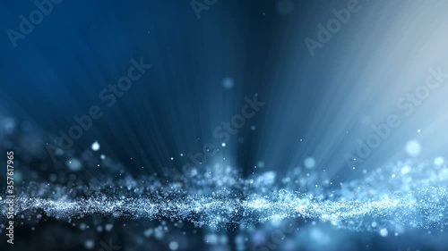 Dark blue abstract animation background with moving and flicker particles form. Backdrop of bokeh light ray effect.
