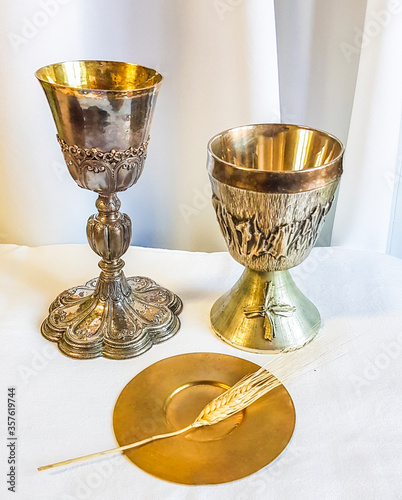 ear of wheat for bread which becomes the body of Christ and chalice to house wine, the blood of Christ. photo