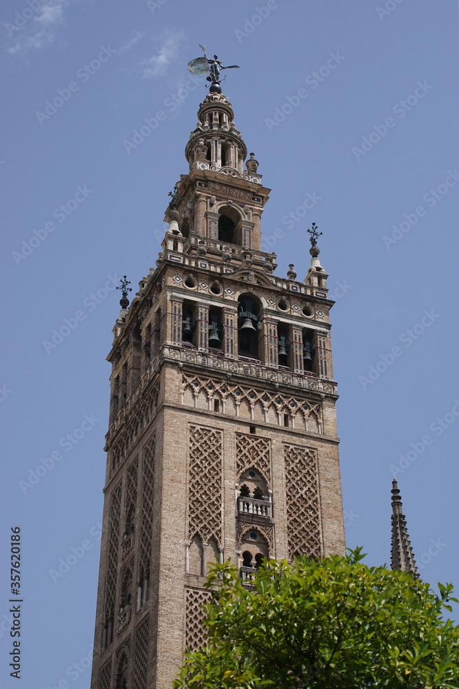 Famous tower of Giralda, Islamic architecture built by the Almohads and crowned by a Renaissance bell tower with the statue of Giraldillo at its highest point.