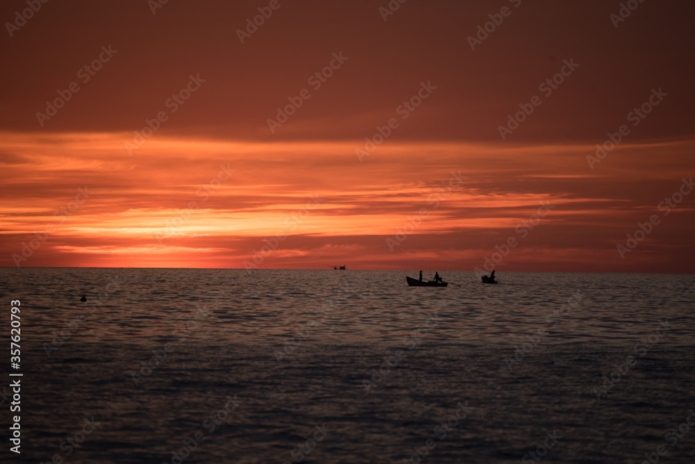 boat in sea with sunset