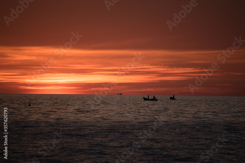 boat in sea with sunset