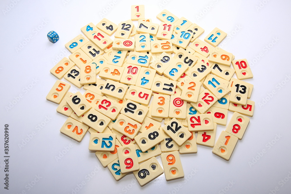 Turkish board game Okey (Rummikub).
Stack composition with game pieces on white ground. Turkish board game Okey (Rummikub).
Stack composition with game pieces on white ground.