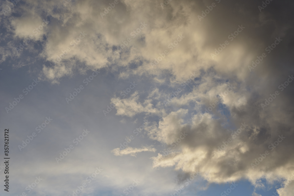 Stormy rain big fluffy clouds. Dark sky. Natural scenic abstract background. Weather changes backdrop. Sky filled with voluminous clouds.